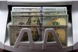 Getty - ATM money cash machine withdrawal dividends income.jpg