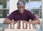 Getty - older man playing chess strategy moves winning.jpg