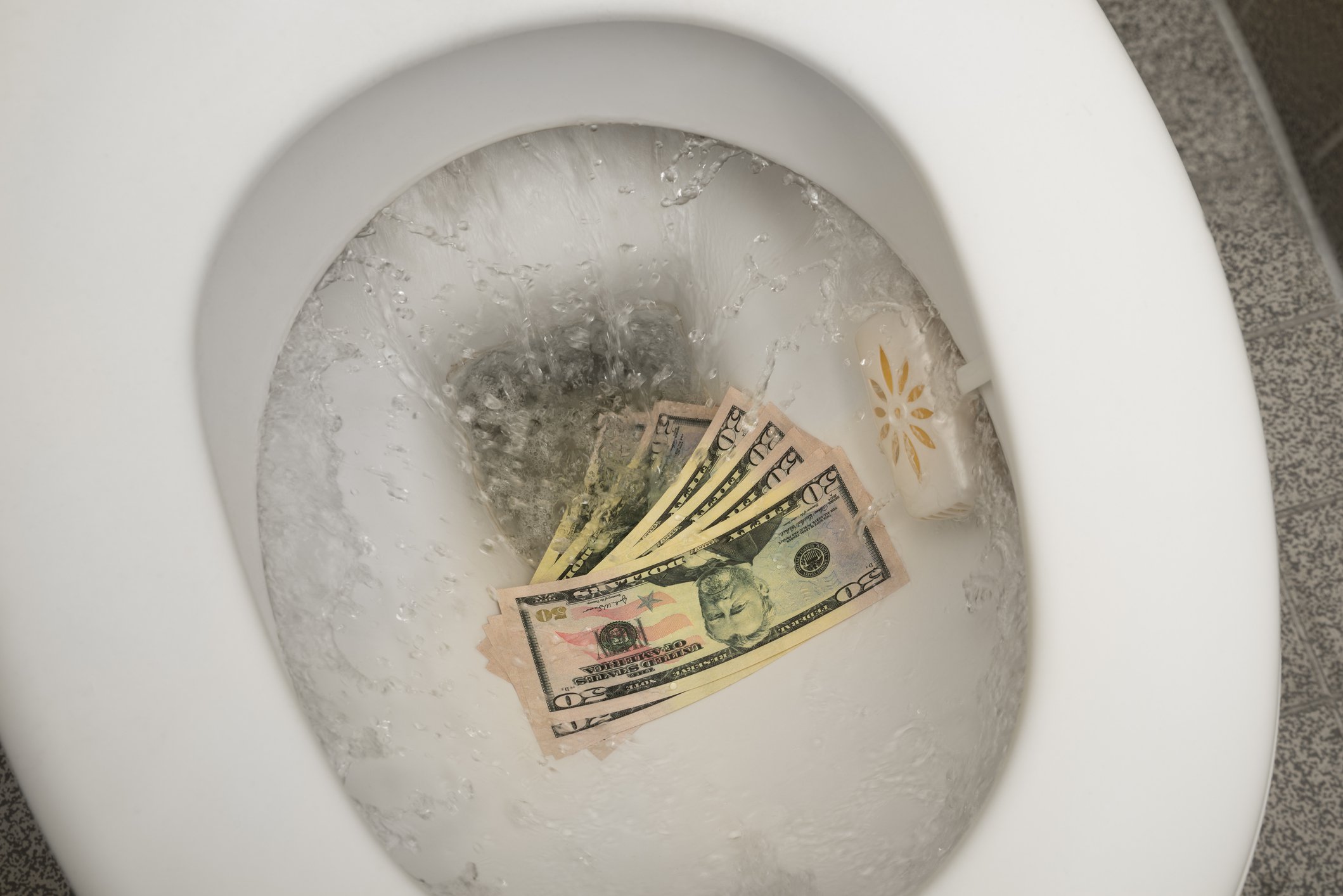 Flushing money down the toilet.