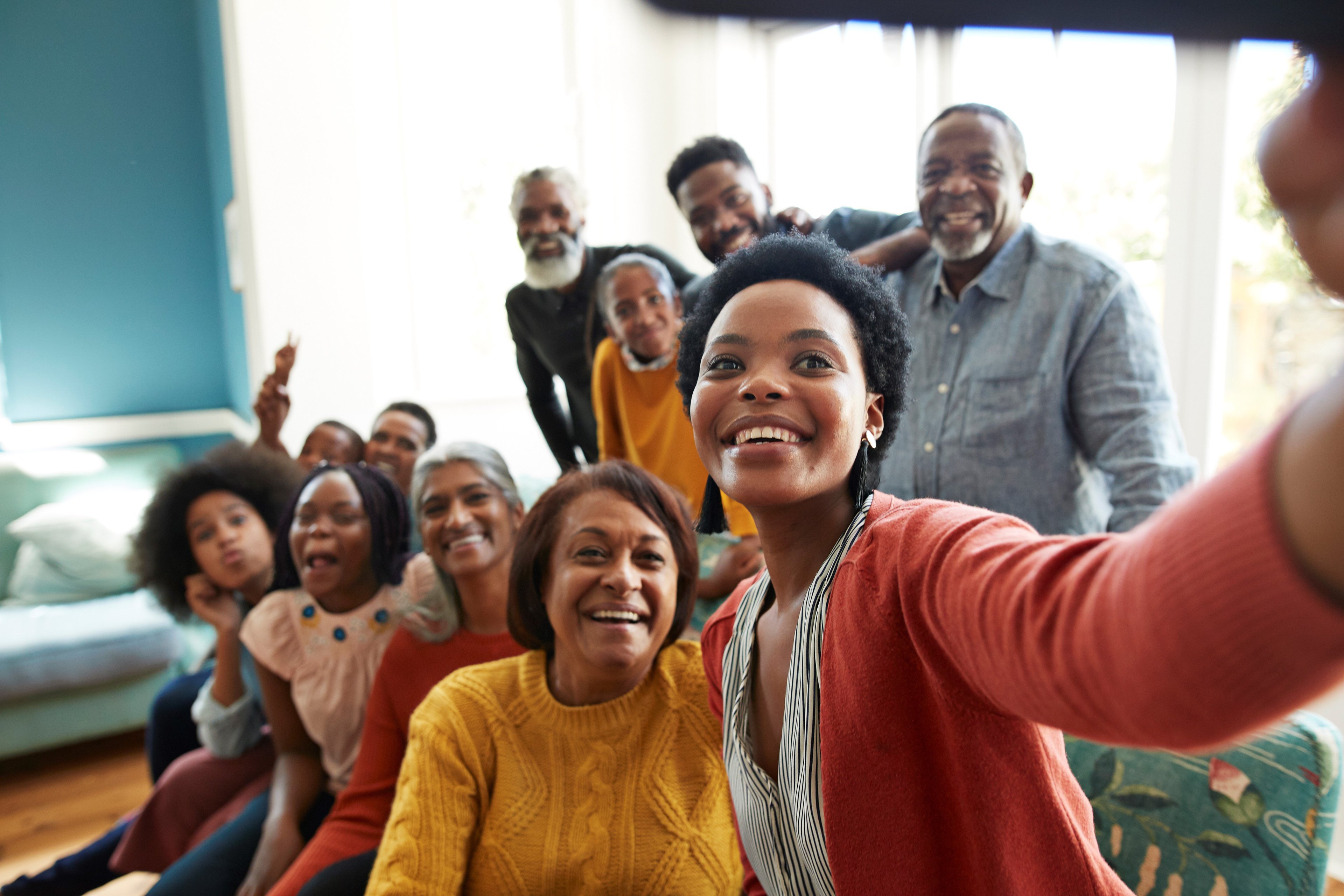A group of people smiling for a selfie.