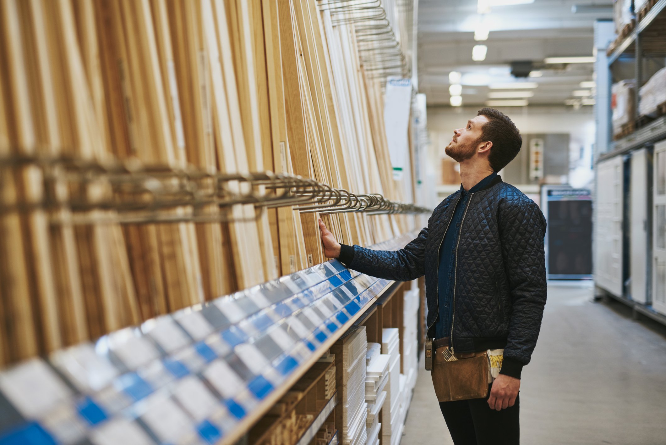 Man standing in aisle of hardware store