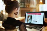 Fashionable woman sitting at laptop and online shopping