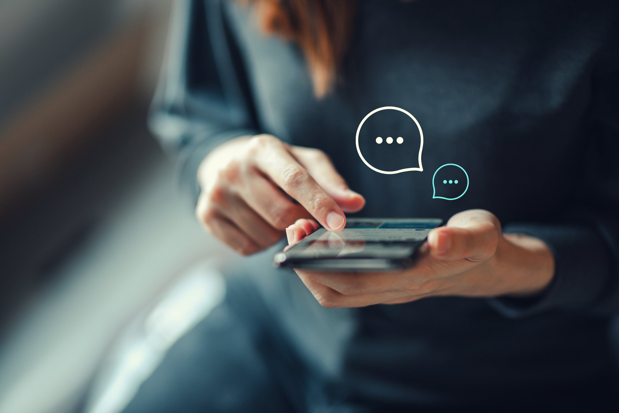 Person opening up chat app on mobile phone