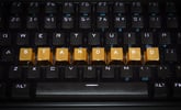 Keyboard with letters rearranged spelling out "STANDARD" in gold letters.