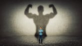 Tiny man with his big strong shadow behind him.jpg