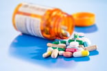 A bottle of pills spilled over.