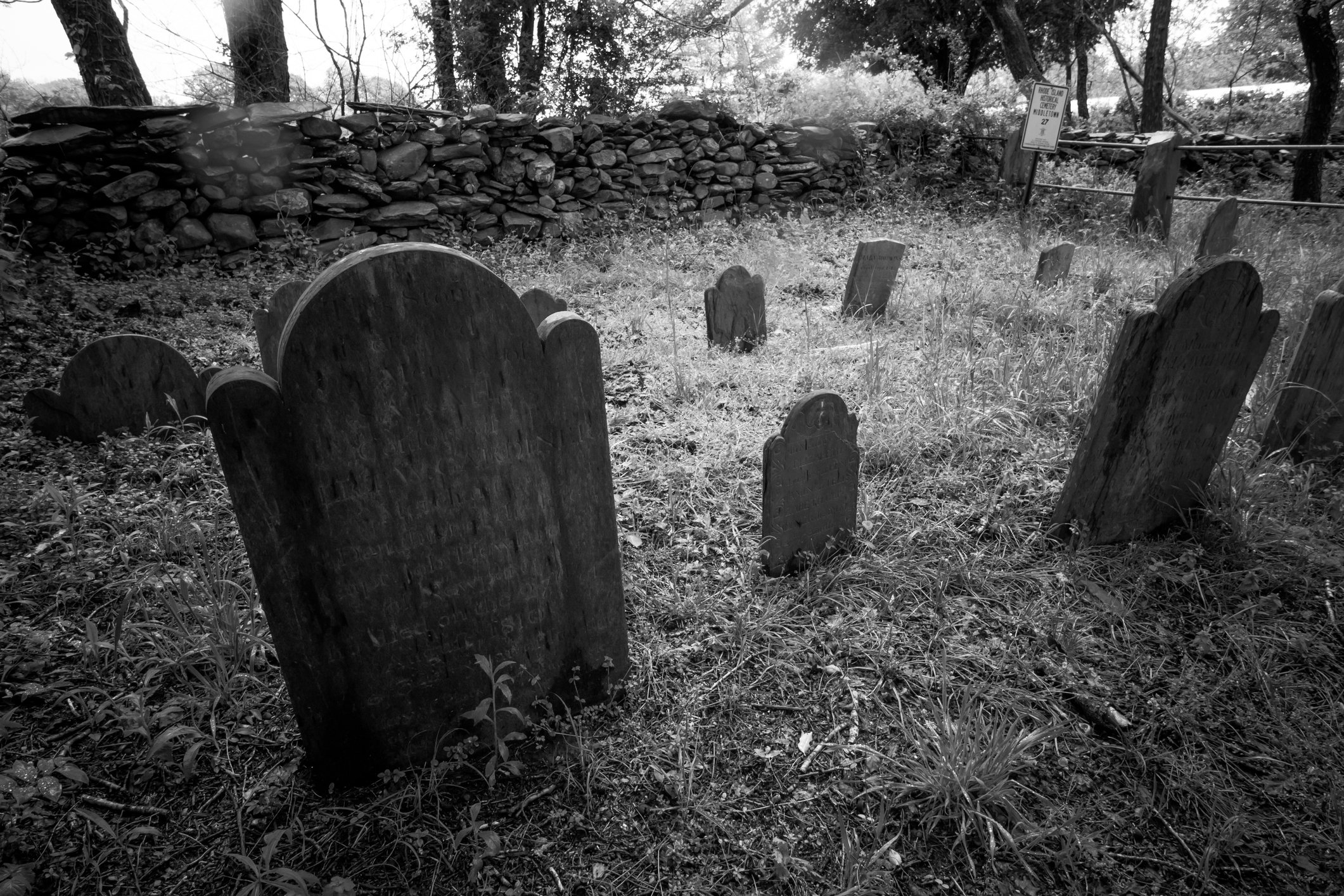 A black and white photo of a graveyard.