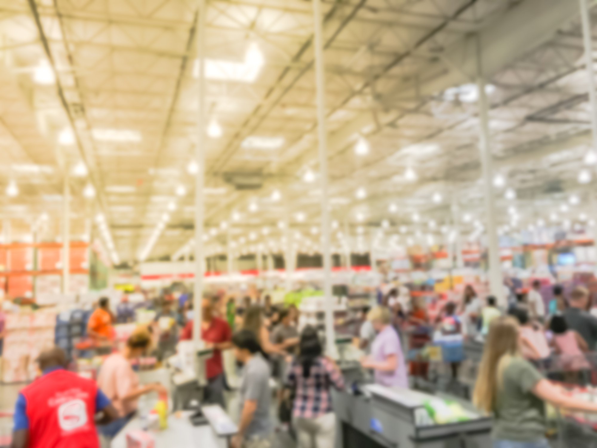 The inside of a busy big box store with lots of customers.