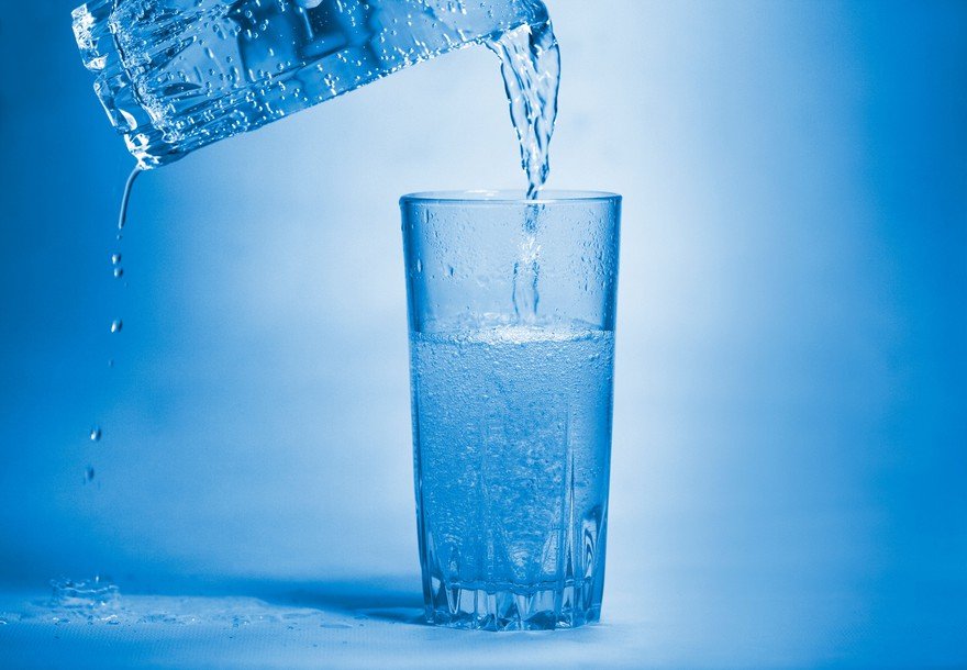 Water pouring from glass to glass.