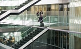 institutional investors walking around a large building