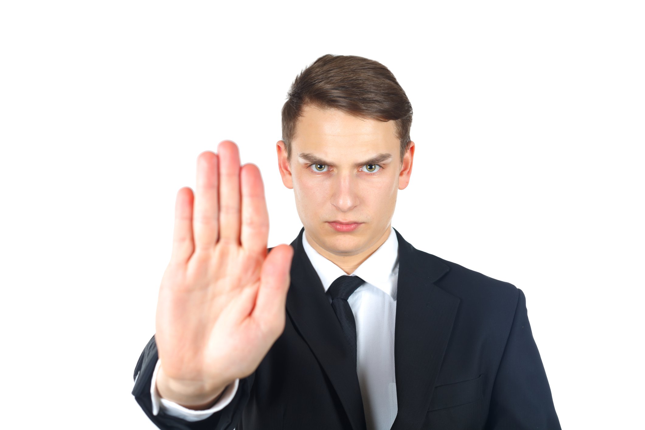 Businessman holding hand in stop signal