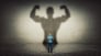 Tiny man with his big strong shadow behind him.jpg