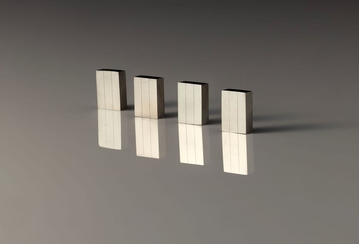 Four NdFeB magnets standing upright.