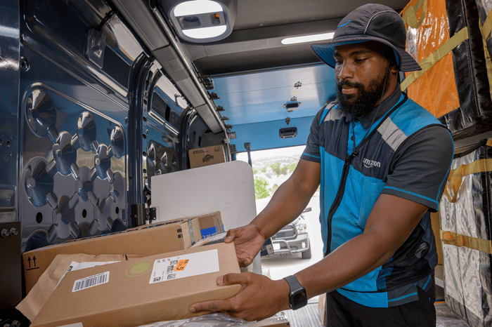 Amazon delivery person with a package.