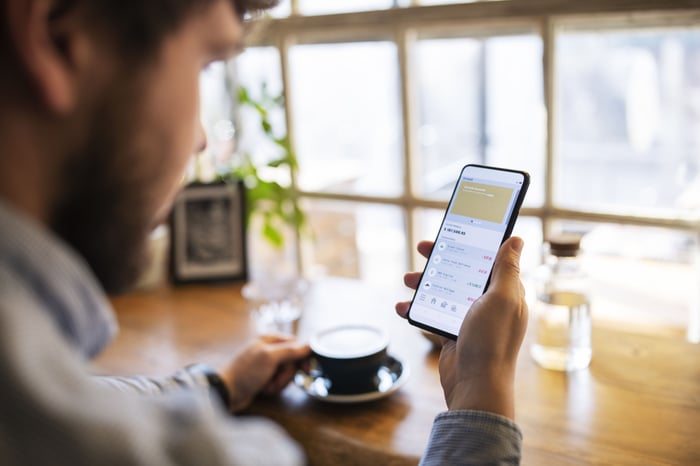 Person using a mobile banking app.