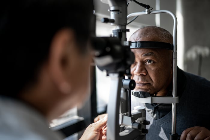 Person undergoing an eye exam.